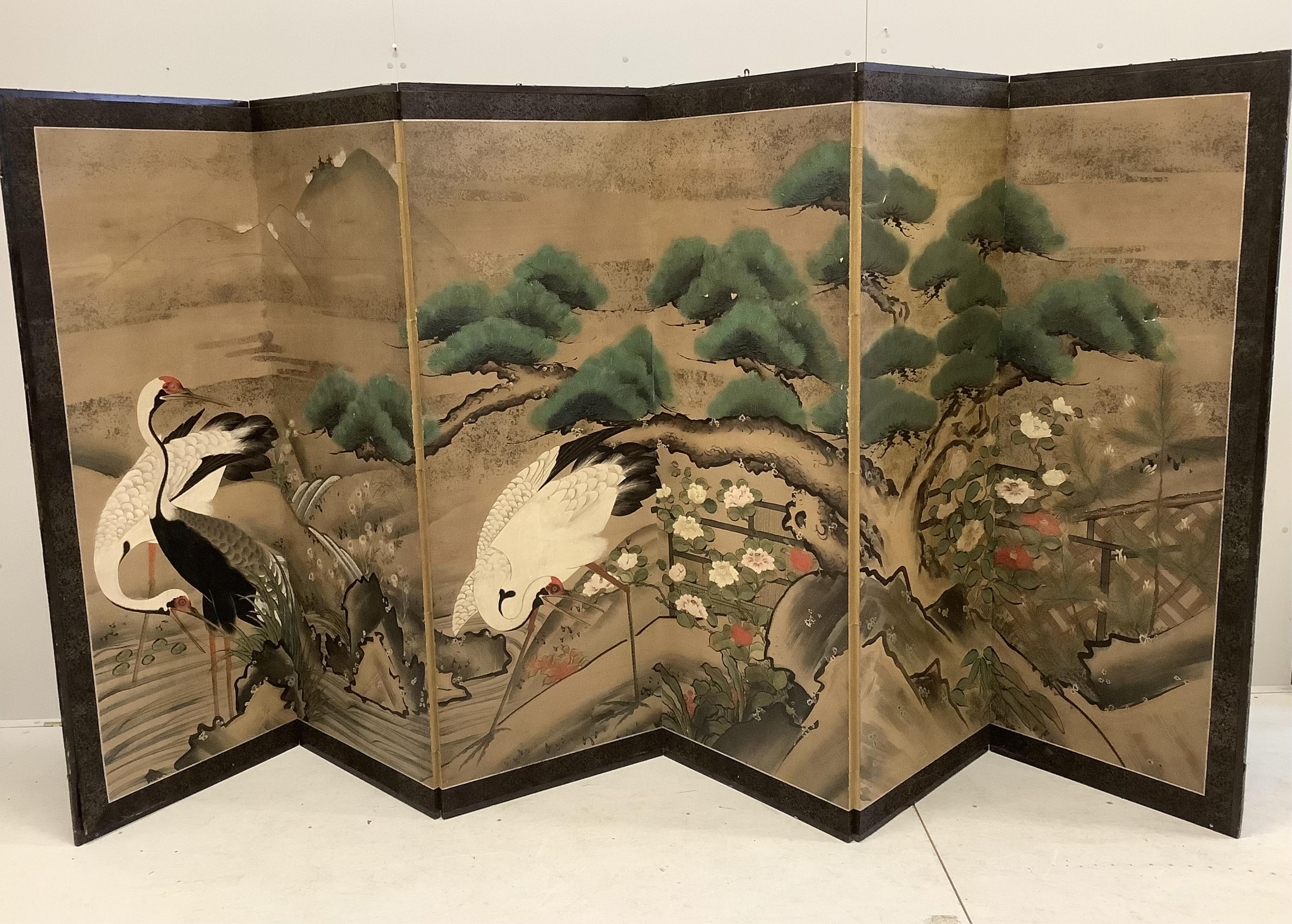 A late 19th century Japanese six section dressing screen, paper laid on frame, decorated with storks in landscape, each panel width 61cm, height 166cm. Condition - fair